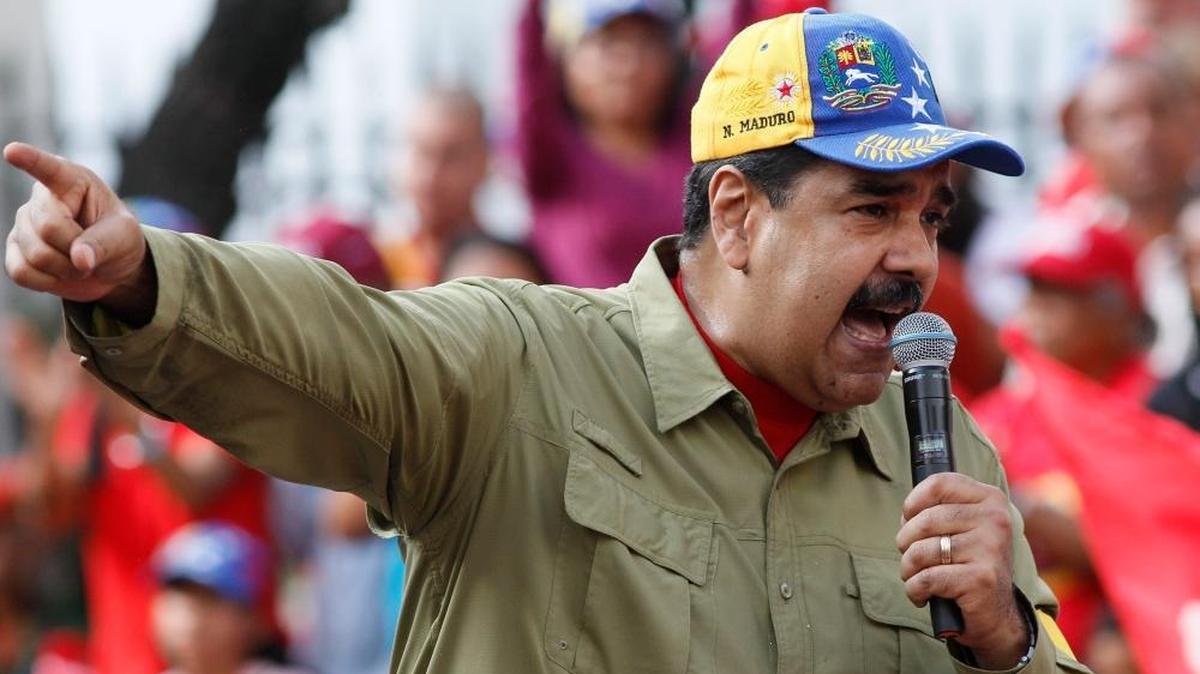 Venezuela's President Nicolas Maduro addresses supporters during a rally marking the anniversary of the 1992 failed coup led by late President Hugo Chavez in Caracas, Venezuela, Sunday, Feb. 4, 2018. Maduro will run for reelection in this year's presidential election.