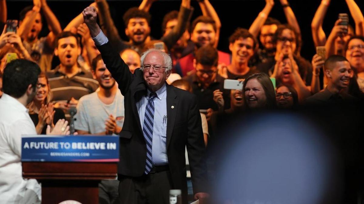 Democratic presidential candidate Sen. Bernie Sanders, I-Vt., greets students in Puerto Rico on Monday.