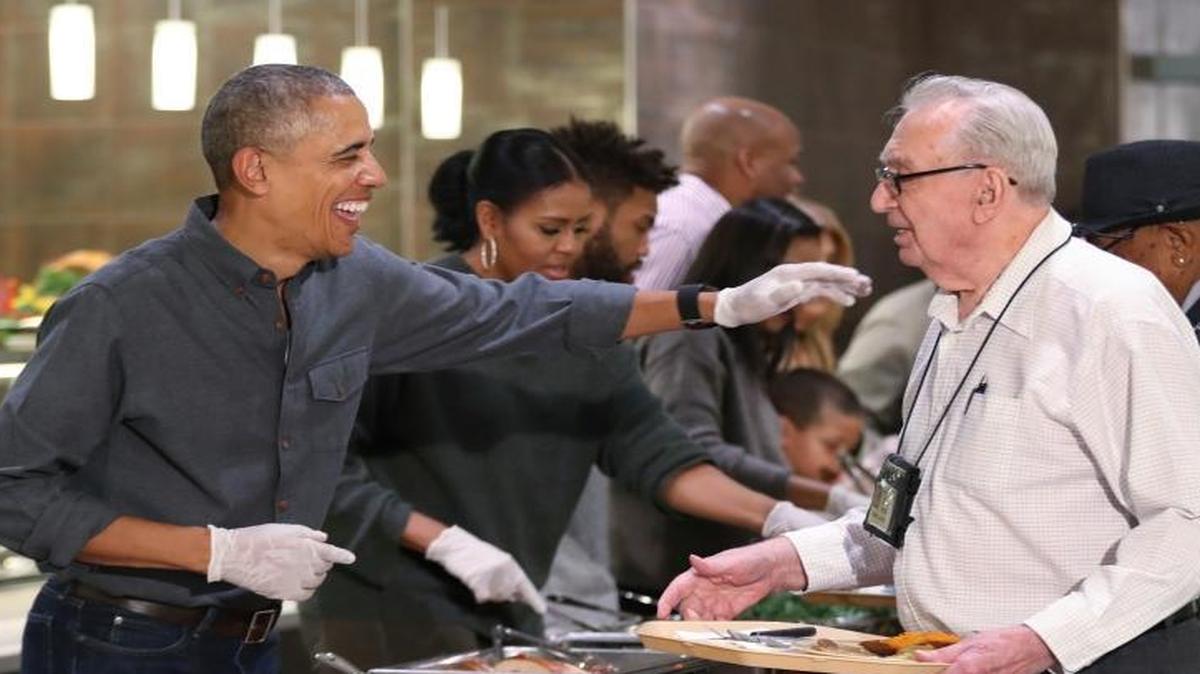 President Barack Obama with first lady Michelle Obama serve Thanksgiving meals to residents of the Armed Forces Retirement Home, in Washington, Wednesday, Nov. 23, 2016.