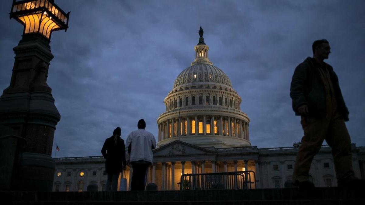 In this Jan. 21, 2018, file photo, lights illuminate the U.S. Capitol on second day of the federal shutdown as lawmakers negotiate behind closed doors in Washington. The era of trillion-dollar budget deficits is about make a comeback _ and a brewing budget deal hastened the arrival. Lawmakers are inching closer to a two-year, budget-busting spending pact that would give whopping budget increases to both the Pentagon and domestic programs have been inching closer to an agreement, according to aides and members of Congress.