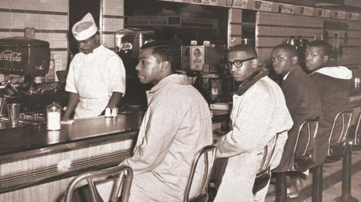 Clarence Henderson, far right, was one of the N.C. A&T College students to occupy lunch counter seats at a Greensboro Woolworth’s in 1960. He says there’s no comparison between Jim Crow and HB2.