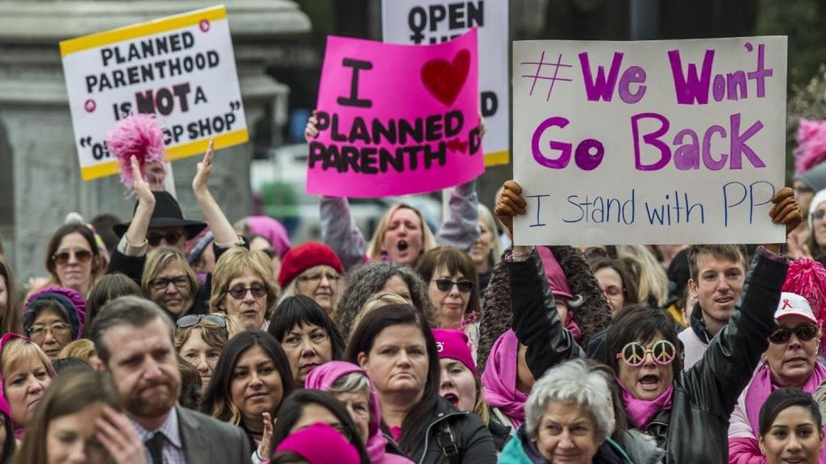 Demonstrators protest planned federal defunding at a Planned Parenthood “Pink Out Day” rally in Sacramento last week.