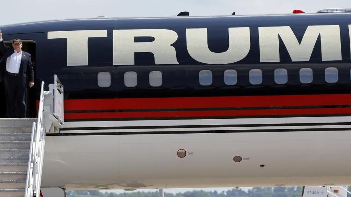 Republican presidential candidate Donald Trump waves as he arrives on his plane at a campaign rally recently.