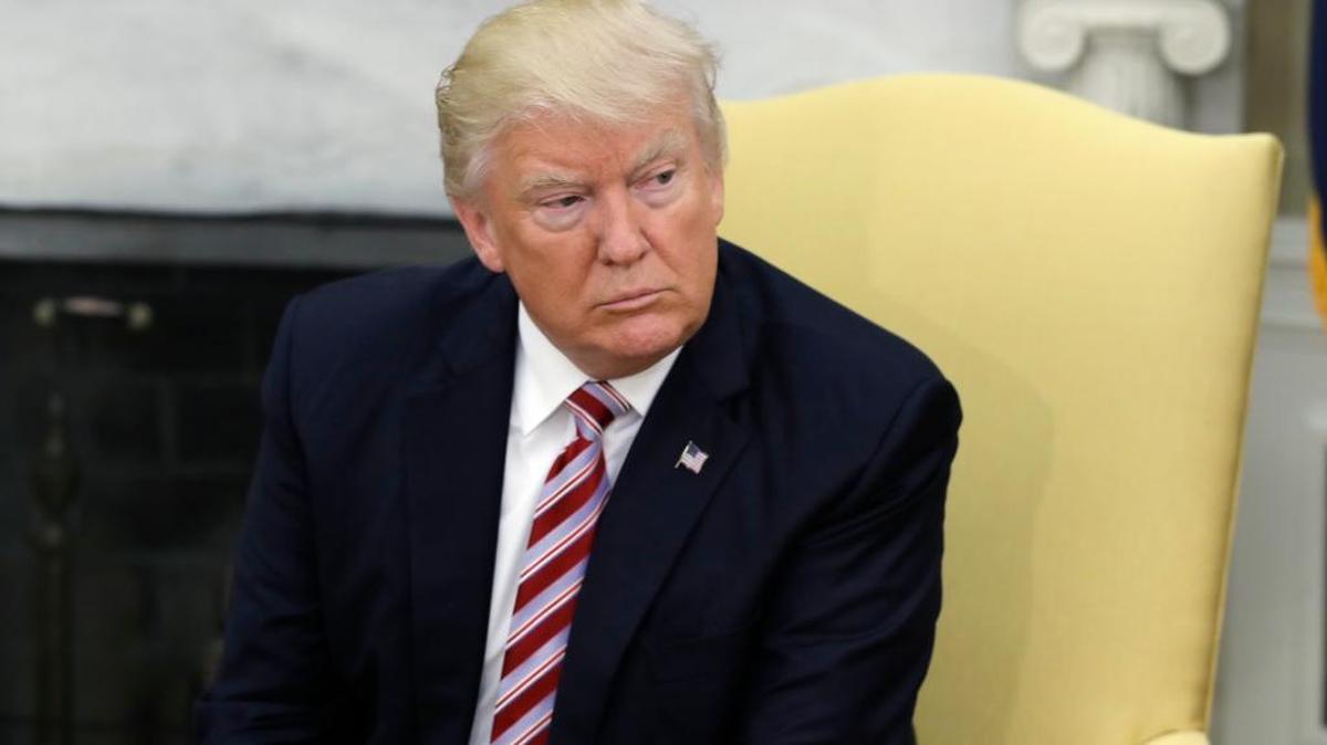 President Donald Trump talks to reporters during a meeting with Dr. Henry Kissinger, former Secretary of State and National Security Advisor under President Richard Nixon, in the Oval Office of the White House, Wednesday, May 10, 2017, in Washington.