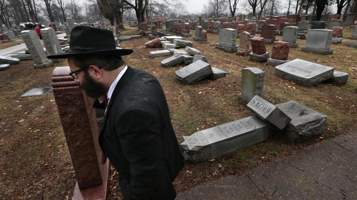 Rabbi Hershey Novack walks through Chesed Shel Emeth Cemetery in University City, Missouri where almost 200 gravestones were vandalized.