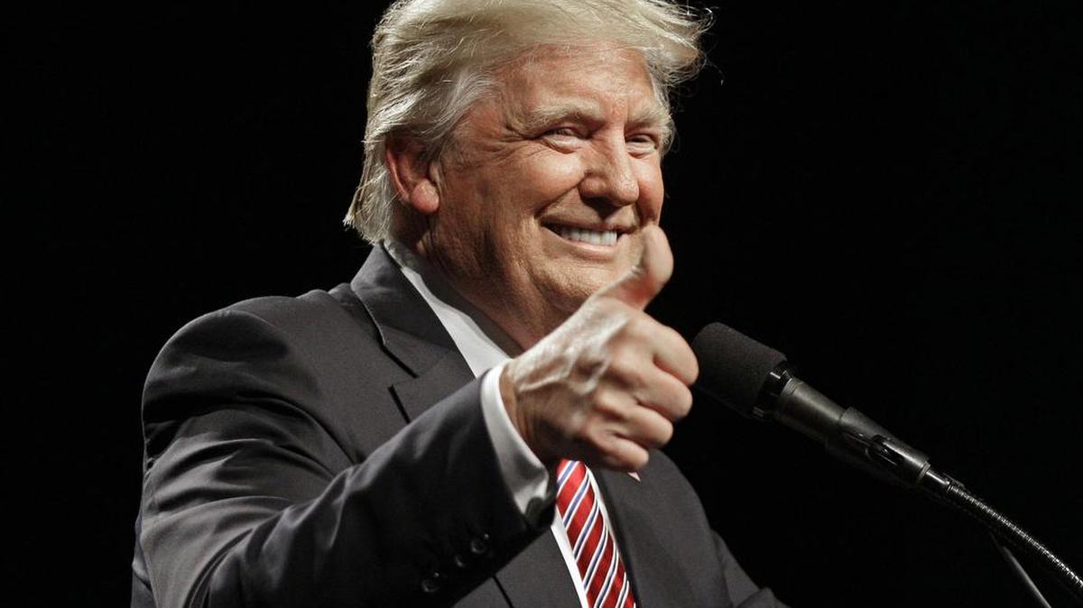 Donald Trump acknowledges the crowd for singing “Happy Birthday” as he speaks during a campaign rally Tuesday at the Greensboro Coliseum.
