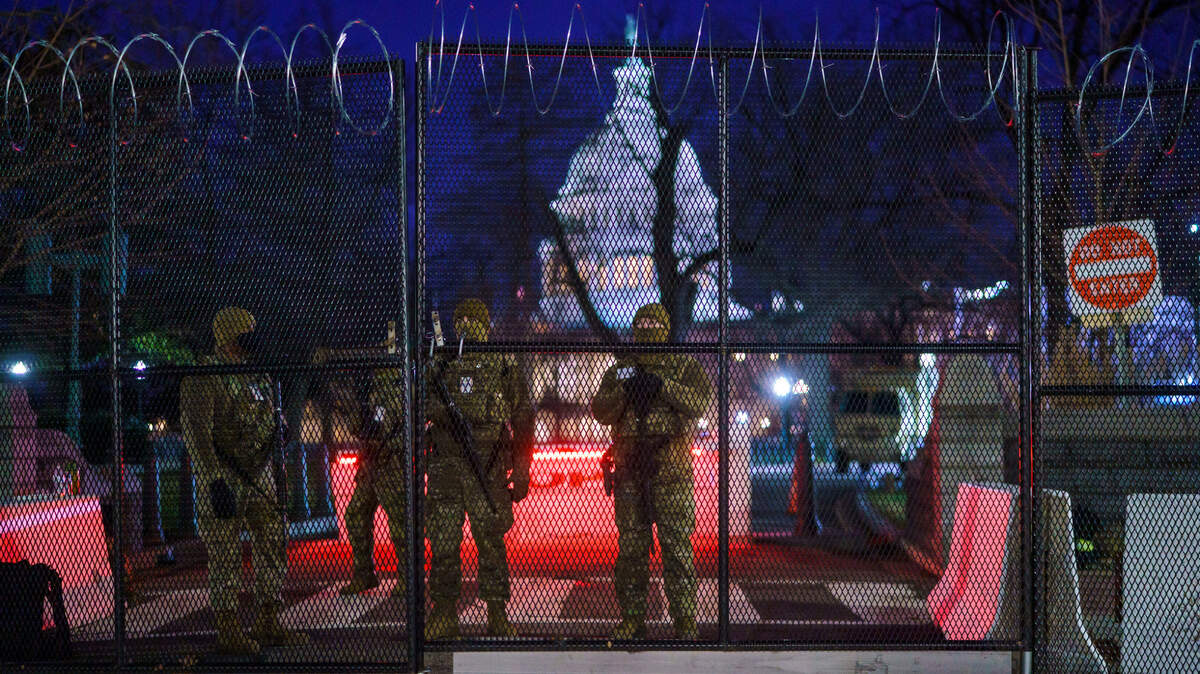 National Guard troops reinforce the security zone on Capitol Hill in Washington, Tuesday, Jan. 19, 2021, before President-elect Joe Biden is sworn in as the 46th president on Wednesday. (AP Photo/J. Scott Applewhite)
